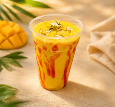 Shahi Mango Lassi topped with pistachio